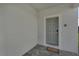 Modern front door with gray door and gray welcome mat at 2201 Lelani Cir, Davenport, FL 33897