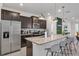 Modern kitchen with granite countertops and stainless steel appliances at 2201 Lelani Cir, Davenport, FL 33897