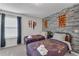 Harry Potter themed bedroom with twin beds and stone wall at 2201 Lelani Cir, Davenport, FL 33897