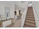 Open concept entryway with staircase and kitchen view at 2201 Lelani Cir, Davenport, FL 33897