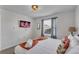 Bedroom with king bed and large window at 2201 Lelani Cir, Davenport, FL 33897