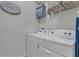 Well-equipped laundry room with washer, dryer, and shelving at 2201 Lelani Cir, Davenport, FL 33897