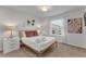 Bright bedroom with a queen bed, gold frame, and window coverings at 2201 Lelani Cir, Davenport, FL 33897