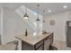 Modern kitchen with granite island, stainless steel appliances, and breakfast bar at 2201 Lelani Cir, Davenport, FL 33897