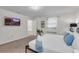 King bedroom with TV and ample closet space at 2201 Lelani Cir, Davenport, FL 33897