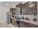 Modern kitchen with granite countertops and stainless steel appliances at 2201 Lelani Cir, Davenport, FL 33897