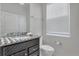 Powder room with granite vanity and toilet at 2201 Lelani Cir, Davenport, FL 33897