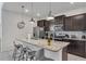 Island kitchen with granite countertops and stainless steel appliances at 2201 Lelani Cir, Davenport, FL 33897