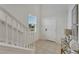 Bright and spacious entryway with staircase and view to kitchen at 2201 Lelani Cir, Davenport, FL 33897