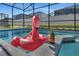 Pool with flamingo float and champagne at 2201 Lelani Cir, Davenport, FL 33897