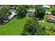 Aerial view showing a house and large lot with surrounding houses at 15 N Bloxham Ave, Fort Meade, FL 33841