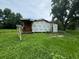 House under construction, surrounded by tall grass at 1134 N Davis Ave, Lakeland, FL 33805