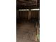 Large unfinished room with open framing and wood flooring at 1134 N Davis Ave, Lakeland, FL 33805