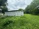 House under construction with Tyvek HomeWrap and large yard at 1134 N Davis Ave, Lakeland, FL 33805