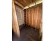 Small unfinished storage room with plywood walls at 1134 N Davis Ave, Lakeland, FL 33805