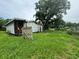 House under construction, surrounded by tall grass at 1134 N Davis Ave, Lakeland, FL 33805