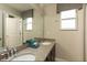 Double vanity bathroom with granite countertop at 177 Bella Verano Way, Davenport, FL 33897