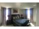 Bedroom with a queen bed and two nightstands at 177 Bella Verano Way, Davenport, FL 33897
