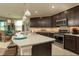 Modern kitchen with granite countertops and stainless steel appliances at 177 Bella Verano Way, Davenport, FL 33897