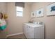 Bright laundry room with washer and dryer at 177 Bella Verano Way, Davenport, FL 33897