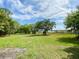 Spacious waterfront lot with mature trees and scenic water views at 850 Eden Dr, Saint Cloud, FL 34771