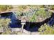 Aerial view of a pond with a gazebo and surrounding trees at 850 Eden Dr, Saint Cloud, FL 34771