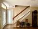 Elegant staircase with wooden railings leading to the upper level at 850 Eden Dr, Saint Cloud, FL 34771