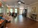 Open living area with hardwood floors, fireplace, and lots of natural light at 850 Eden Dr, Saint Cloud, FL 34771