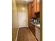 Kitchen with wood cabinets and a stainless steel dishwasher at 850 Eden Dr, Saint Cloud, FL 34771