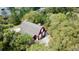 Aerial view of red barn nestled in lush greenery at 850 Eden Dr, Saint Cloud, FL 34771