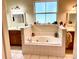 Bathroom with double vanity, garden tub, and separate shower at 850 Eden Dr, Saint Cloud, FL 34771