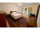 Cozy bedroom with a double bed, nightstands and area rug at 850 Eden Dr, Saint Cloud, FL 34771
