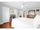 Bedroom with double bed, wood dresser and hardwood floors at 11407 Bentry St, Orlando, FL 32824
