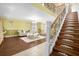 Elegant staircase with wrought iron railings leading to the second floor at 11407 Bentry St, Orlando, FL 32824