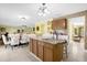 Kitchen with granite countertops, wood cabinets, and an island at 11407 Bentry St, Orlando, FL 32824