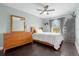 Bedroom with a full-size bed, dresser, and hardwood floors at 11407 Bentry St, Orlando, FL 32824