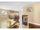 View of upper hallway with open railing overlooking entryway at 11407 Bentry St, Orlando, FL 32824