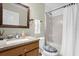 Simple bathroom with shower/tub combo and granite vanity at 11407 Bentry St, Orlando, FL 32824