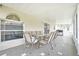 Covered patio with outdoor dining set and grill at 11407 Bentry St, Orlando, FL 32824