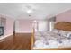 Primary bedroom with wood floors and an en-suite bathroom at 11407 Bentry St, Orlando, FL 32824