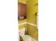 Small bathroom with a toilet and wall-mounted cabinet at 11407 Bentry St, Orlando, FL 32824