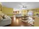 Living room with hardwood floors, a view of the kitchen and backyard at 11407 Bentry St, Orlando, FL 32824