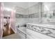 Modern bathroom with a soaking tub and walk-in shower at 11407 Bentry St, Orlando, FL 32824
