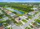 Aerial view of a beautiful house in a residential neighborhood with a lake at 11407 Bentry St, Orlando, FL 32824
