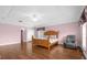 Spacious bedroom with wood floors and large windows at 11407 Bentry St, Orlando, FL 32824