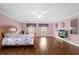Primary bedroom with hardwood floors and a ceiling fan at 11407 Bentry St, Orlando, FL 32824