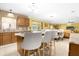 Kitchen with granite counters, wood cabinets, and island at 11407 Bentry St, Orlando, FL 32824