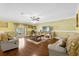 Gathering room with hardwood floors, ceiling fan, and comfortable seating at 11407 Bentry St, Orlando, FL 32824