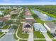 Aerial view of a house with solar panels, near a lake at 11407 Bentry St, Orlando, FL 32824