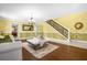 Open living room with hardwood floors, a white sofa, and a view to the kitchen at 11407 Bentry St, Orlando, FL 32824